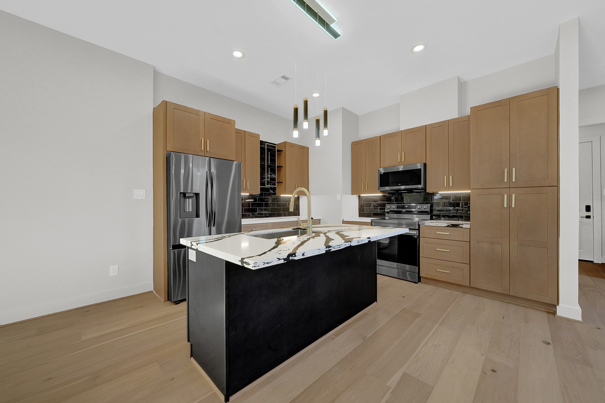 3630 Lydia Street Houston, TX 77021 - Photo 9 of 27 a kitchen with stainless steel appliances granite countertop a sink stove and refrigerator