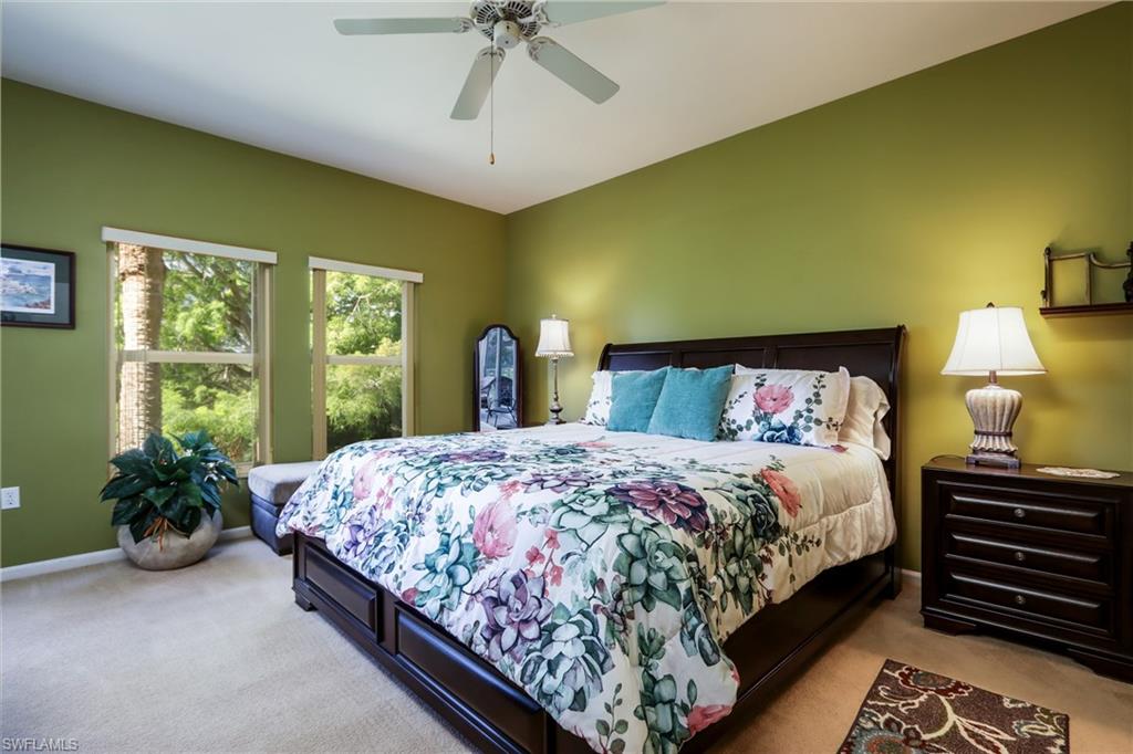 5895 Chanteclair Drive, Unit 114 Naples, FL 34108 - Photo 12 of 21 Carpeted bedroom featuring baseboards and a ceiling fan