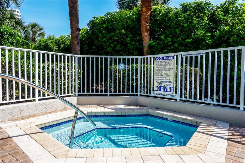 5895 Chanteclair Drive, Unit 114 Naples, FL 34108 - Photo 17 of 21 View of swimming pool with a swimming pool and a community hot tub