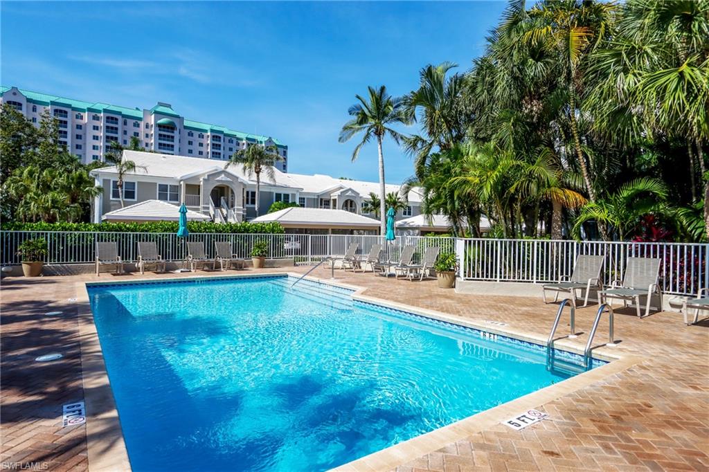 5895 Chanteclair Drive, Unit 114 Naples, FL 34108 - Photo 18 of 21 Community pool with a patio area