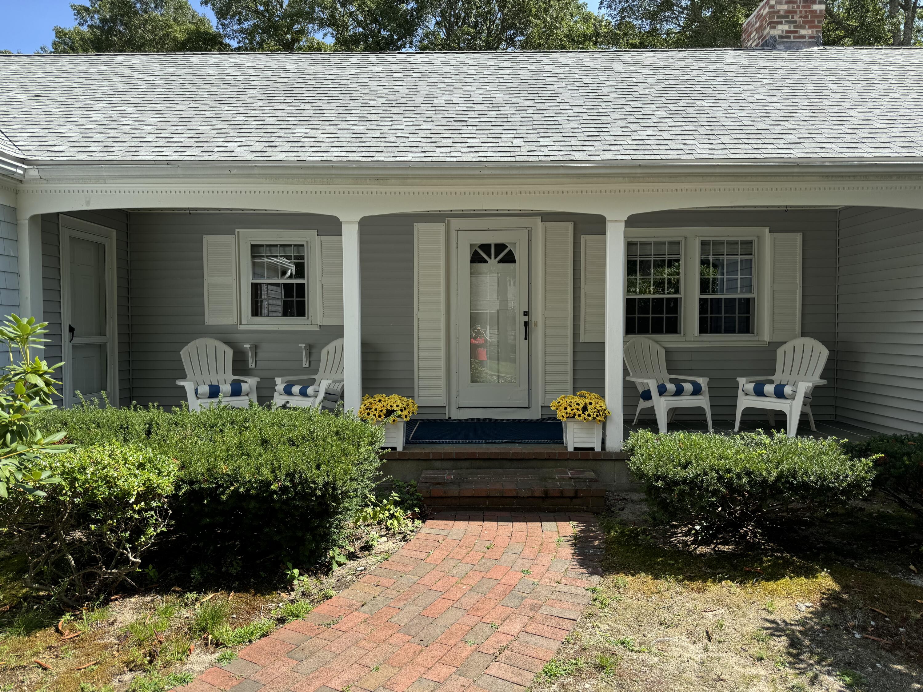 a front view of a house with a yard
