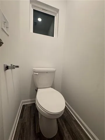 a bathroom with a toilet and a sink