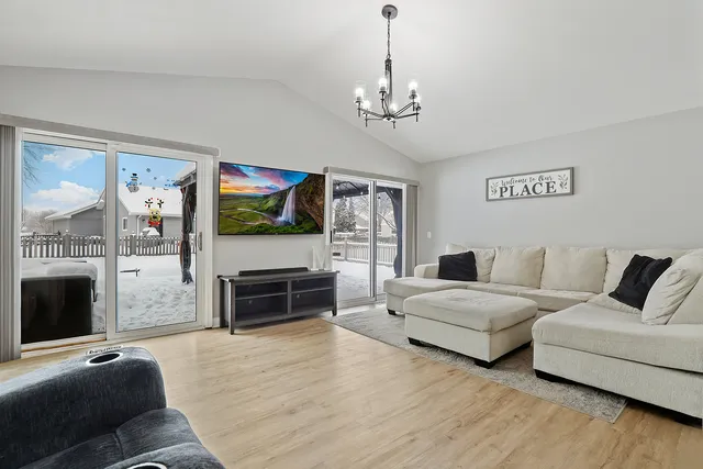 a living room with furniture flat screen tv and a fireplace