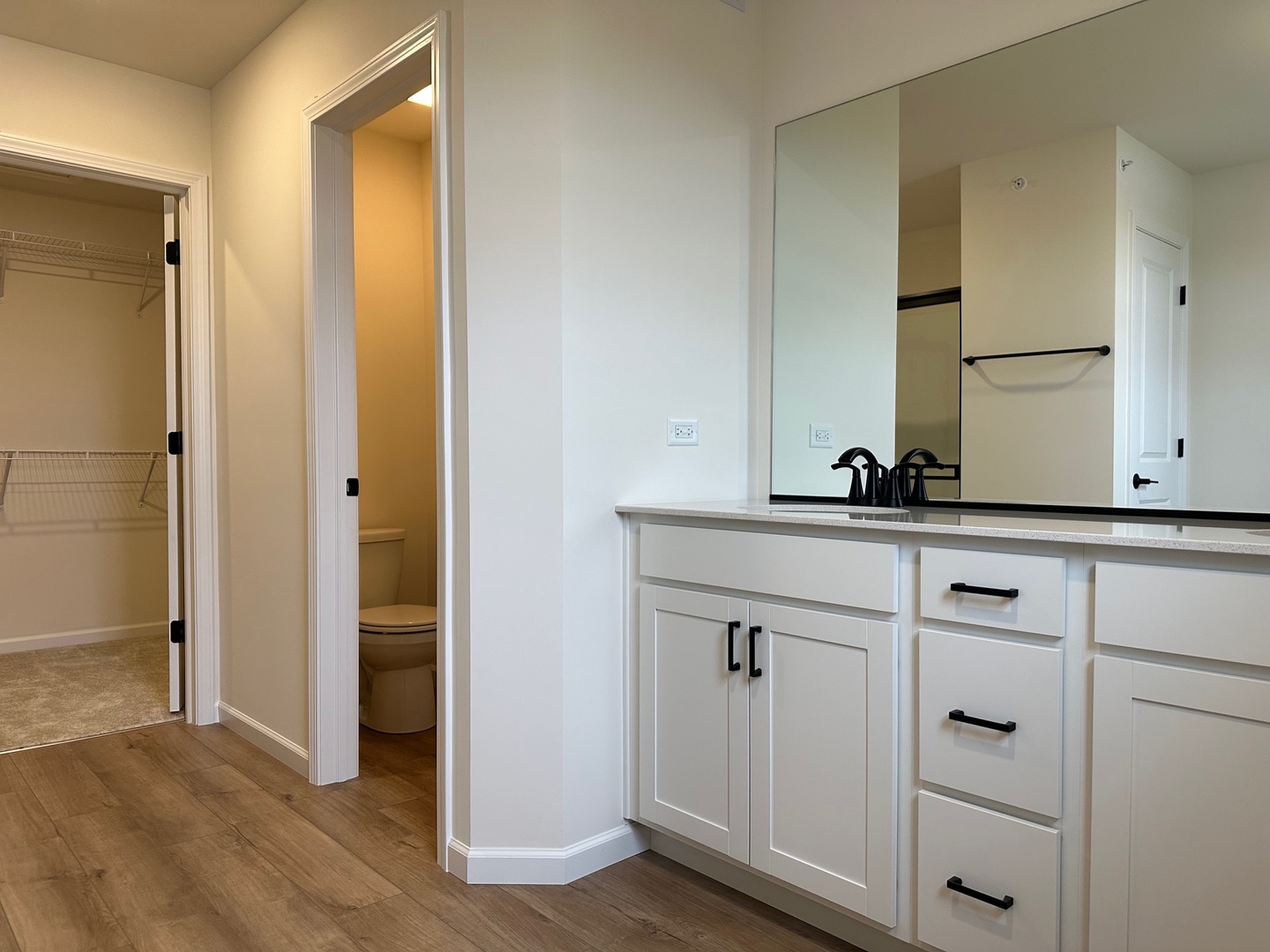 5949 Hawkweed Drive Plainfield, IL 60585 - Photo 15 of 25 a bathroom with a sink and a mirror