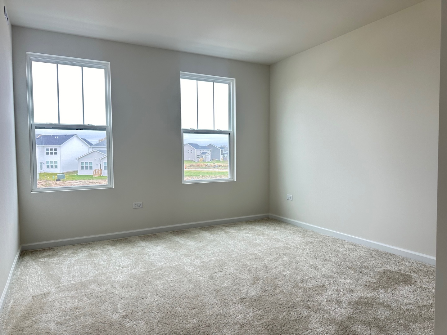 5949 Hawkweed Drive Plainfield, IL 60585 - Photo 18 of 25 an empty room with windows