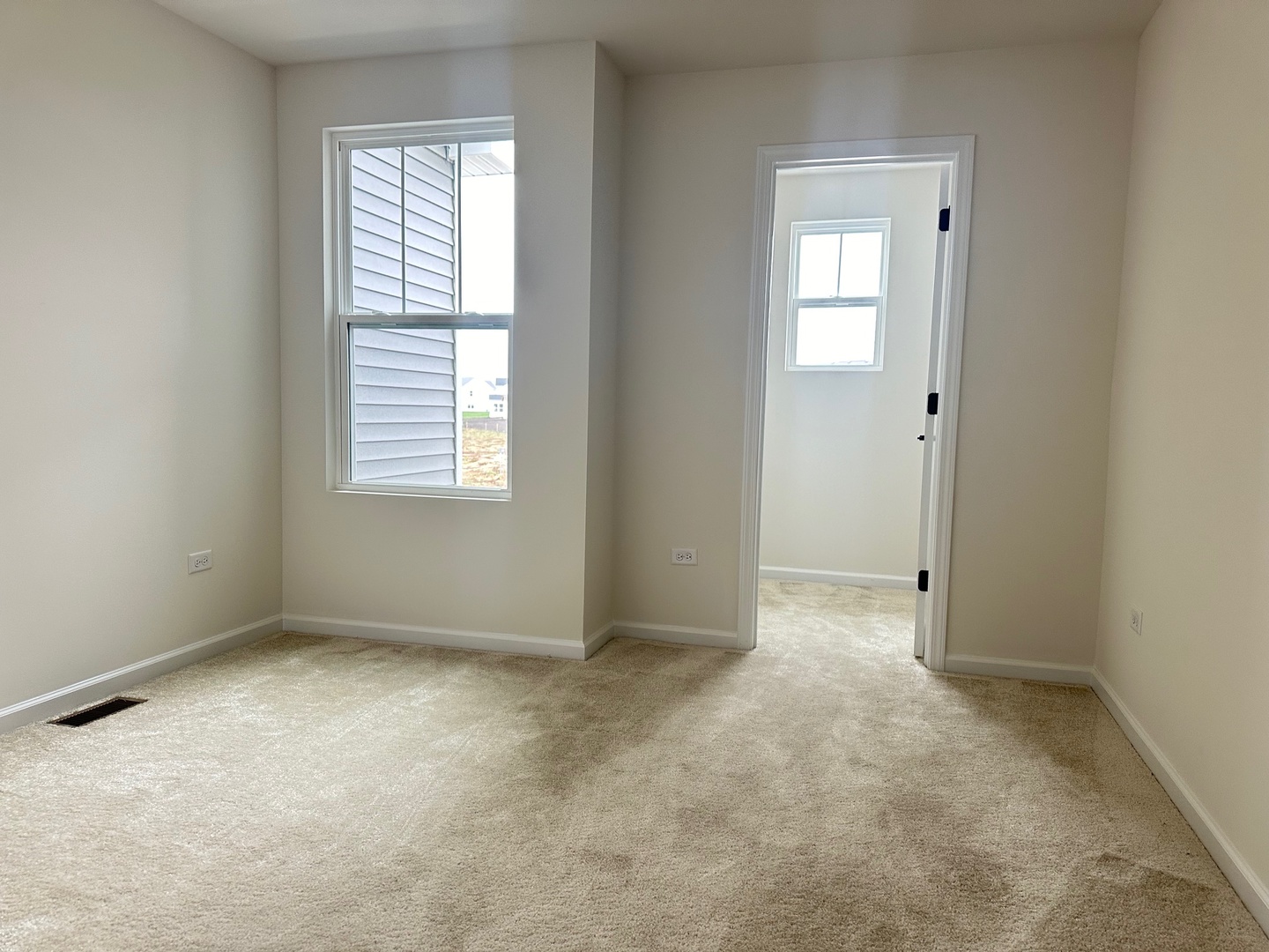 5949 Hawkweed Drive Plainfield, IL 60585 - Photo 19 of 25 an empty room with windows