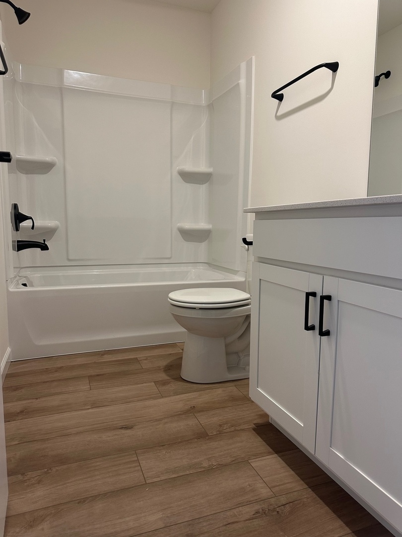 5949 Hawkweed Drive Plainfield, IL 60585 - Photo 20 of 25 a bathroom with a toilet and a shower