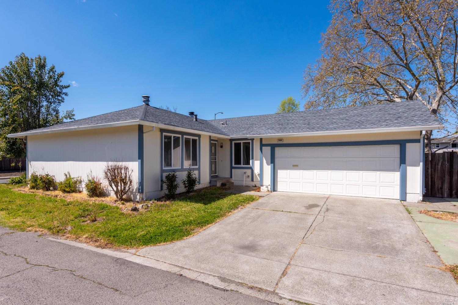 1096 Dickens Drive Santa Rosa, CA 95401 - Photo 1 of 1 a front view of a house with a yard and garage