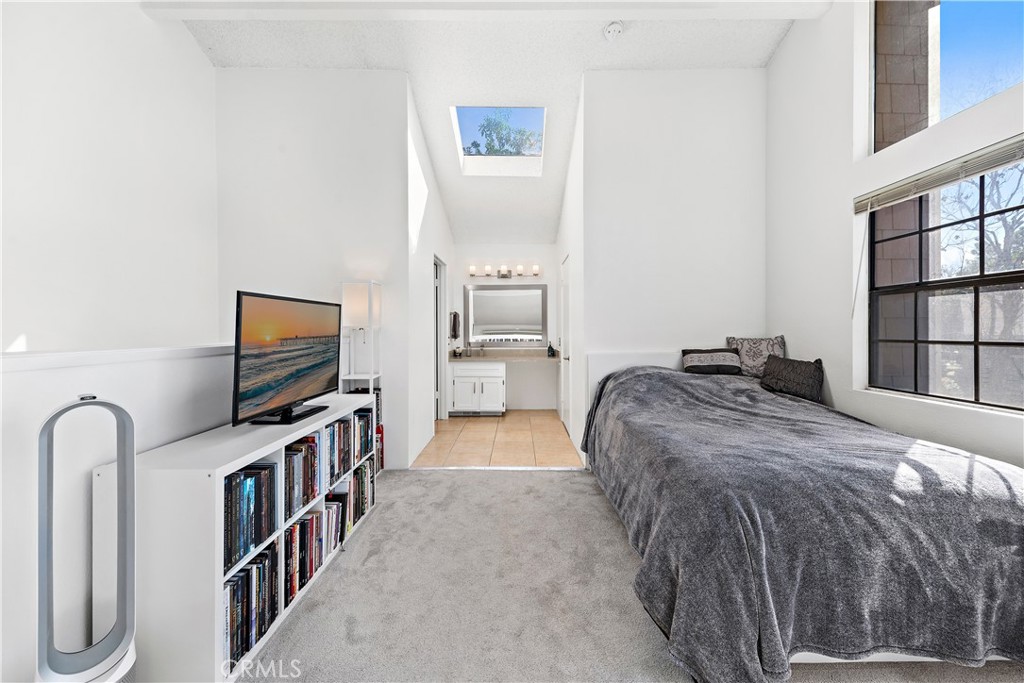 165 Pineview Irvine, CA 92620 - Photo 12 of 23 a bedroom with a bed and a flat tv screen on a dresser