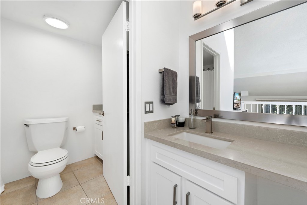 165 Pineview Irvine, CA 92620 - Photo 14 of 23 a bathroom with a toilet sink and mirror