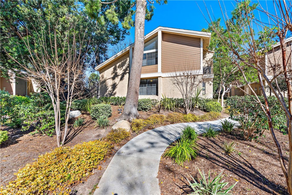 165 Pineview Irvine, CA 92620 - Photo 17 of 23 a front view of a house with a yard