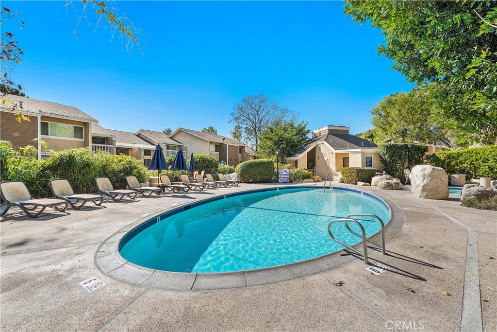165 Pineview Irvine, CA 92620 - Photo 19 of 23 a view of a swimming pool with a lounge chairs