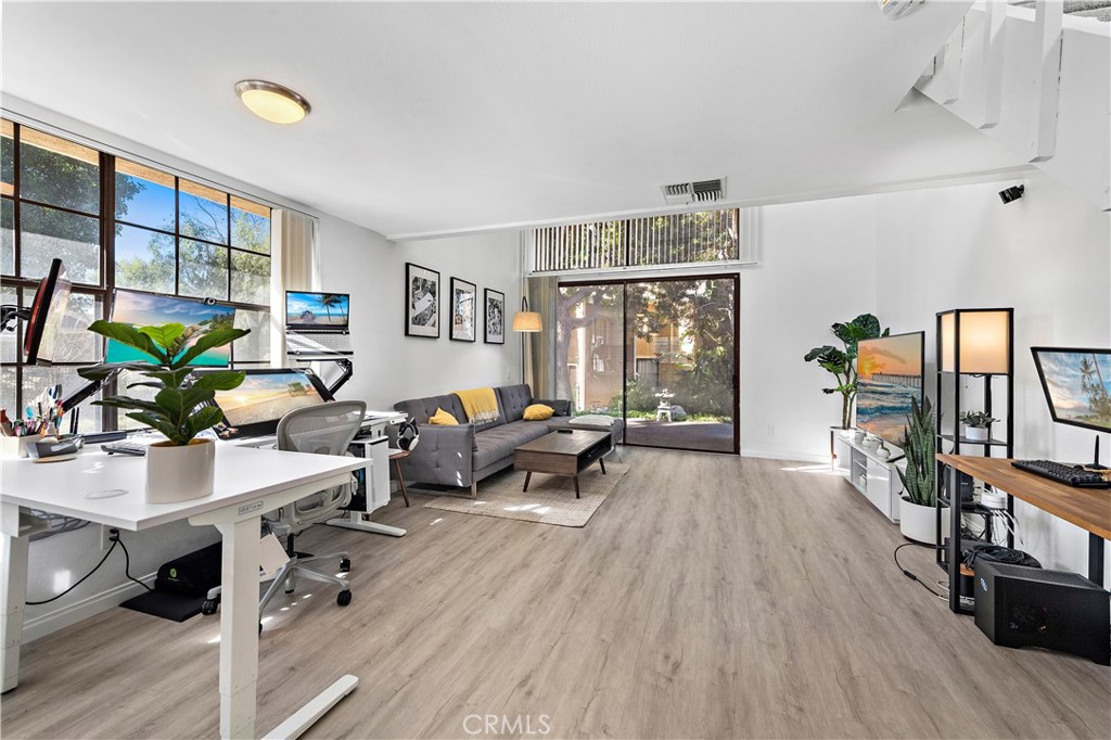 165 Pineview Irvine, CA 92620 - Photo 6 of 23 a living room with furniture floor to ceiling window and wooden floor