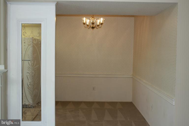 120 Fort Evans Road Southeast, Unit F Leesburg, VA 20175 - Photo 11 of 13 Antique door w/etched glass separates DR from FR