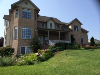637 Long Meadow Road Fishersville, VA 22939 - Photo 2 of 4 a front view of a house with garden