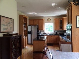637 Long Meadow Road Fishersville, VA 22939 - Photo 4 of 4 a living room with furniture a large window and a refrigerator