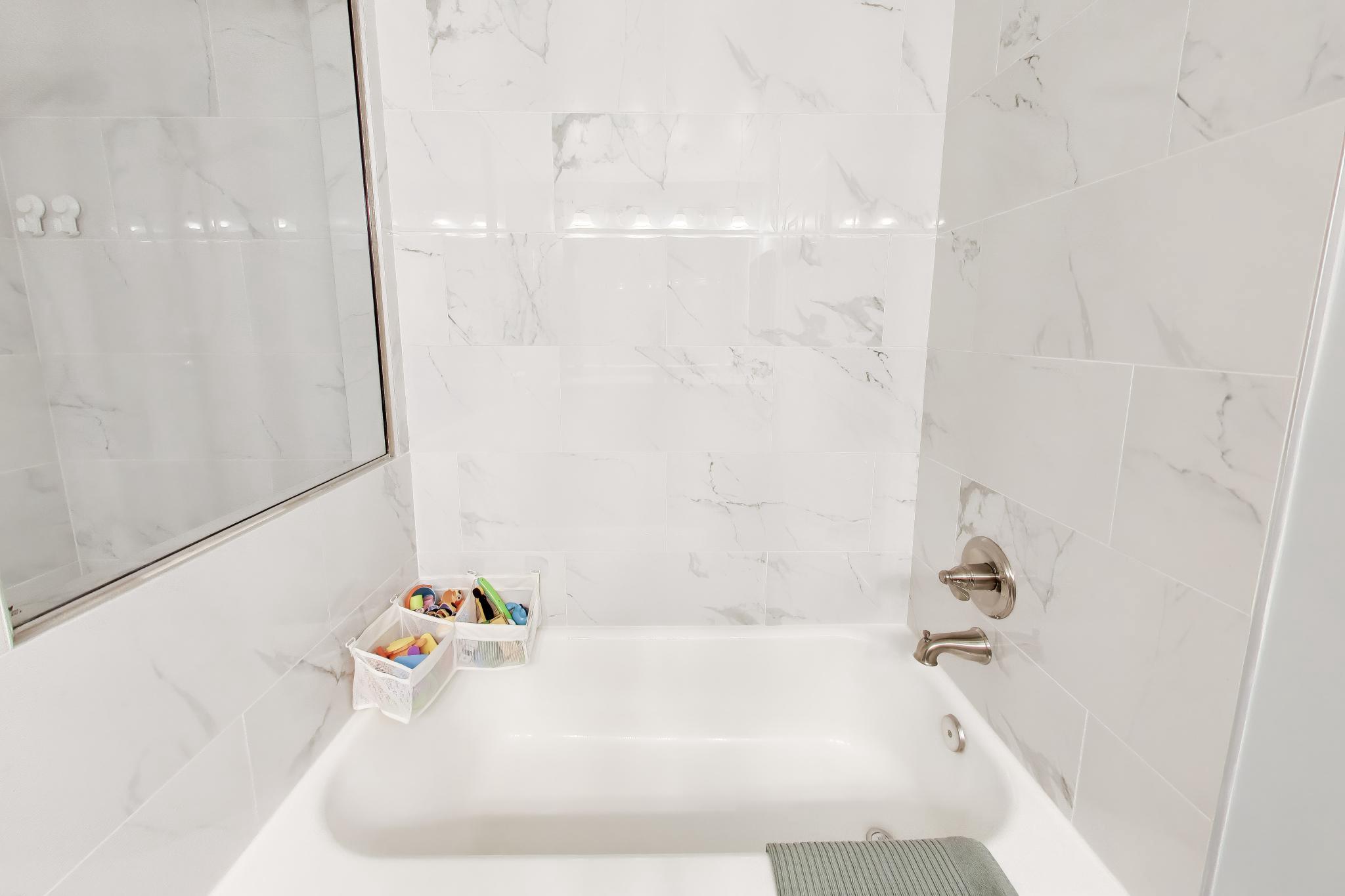 11830 Breton Court, Unit 23B Reston, VA 20191 - Photo 34 of 43 Bathtub with Marble surround