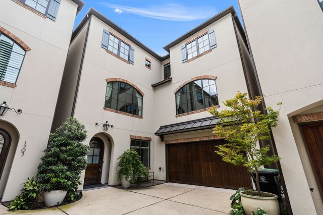 a view of a car parked in front of a building