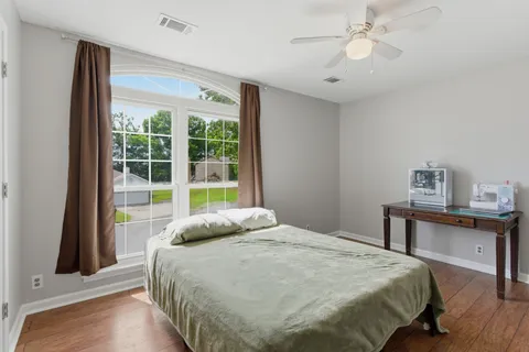 a bedroom with a large bed and a window
