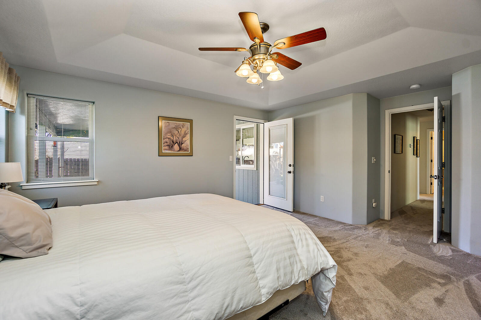 890 Ridgeview Drive Eagle Point, OR 97524 - Photo 24 of 35 a bedroom with a large bed and a chandelier