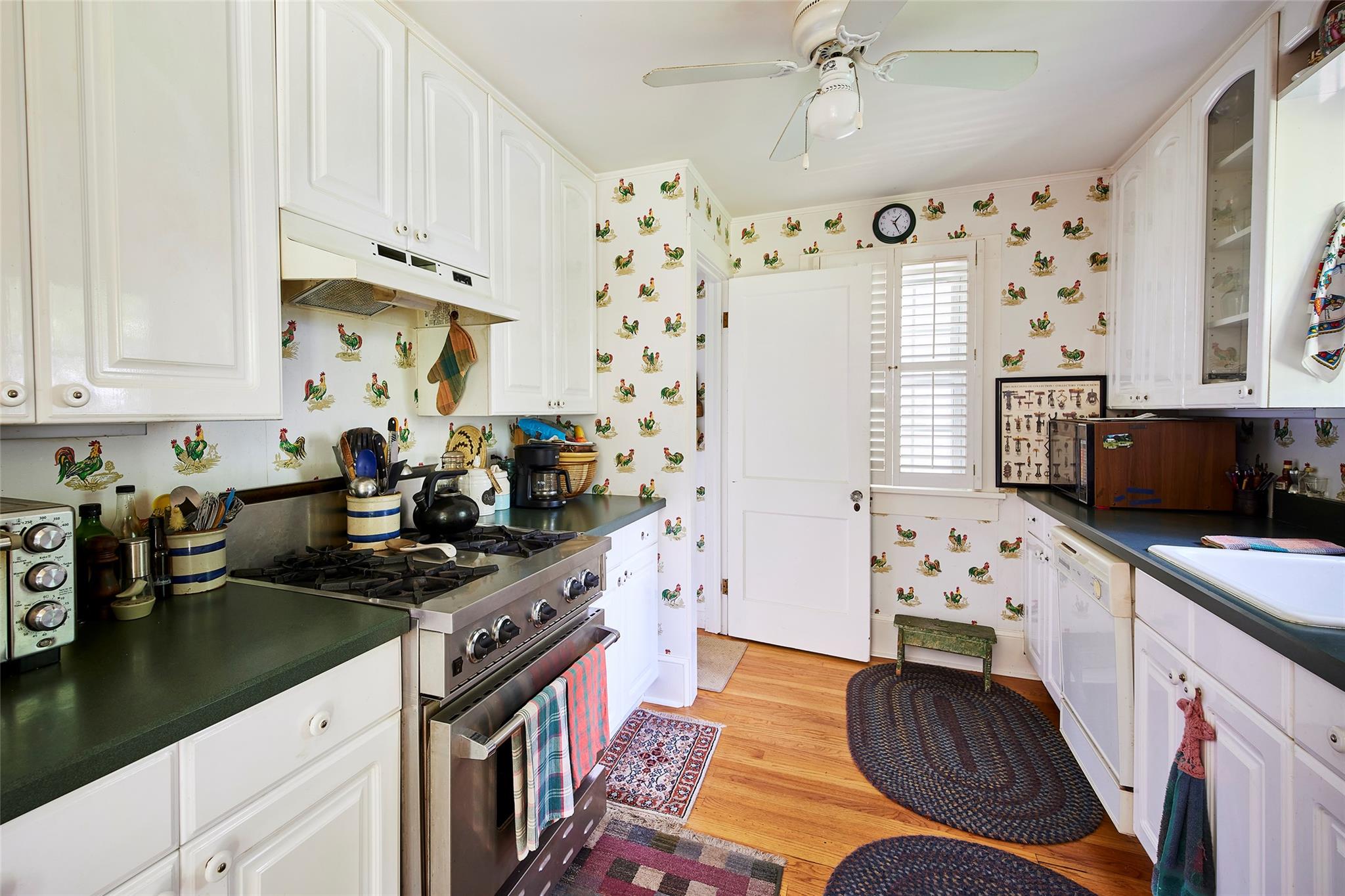 7 Harding Lane Roscoe, NY 12776 - Photo 13 of 26 a kitchen with stainless steel appliances a stove a sink a refrigerator wooden floor and cabinets
