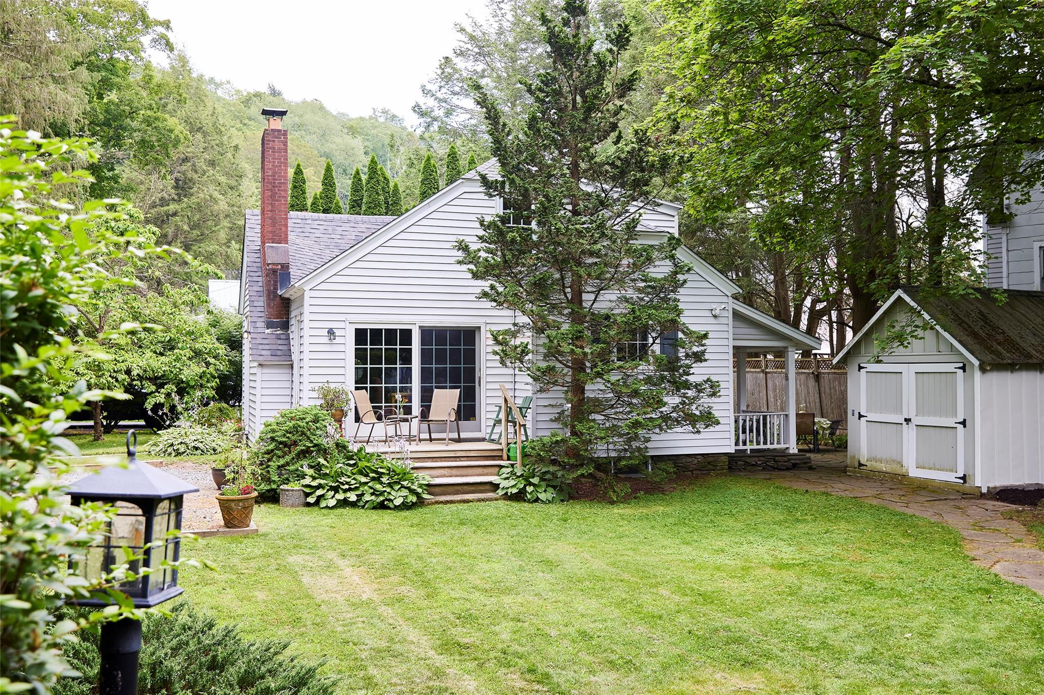 7 Harding Lane Roscoe, NY 12776 - Photo 3 of 26 a front view of a house with a garden
