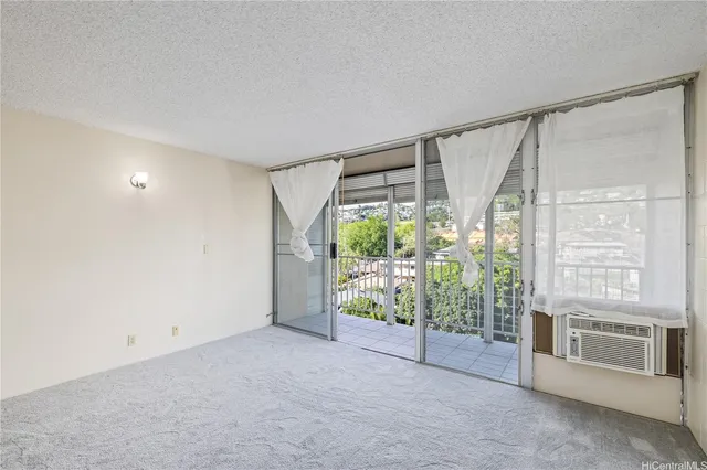 a view of an empty room with a sliding door