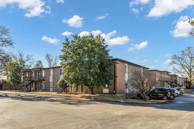 a view of street along with parked cars