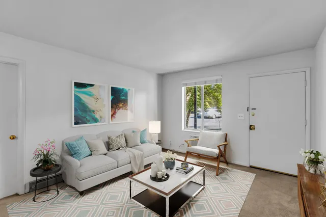 a living room with furniture and window