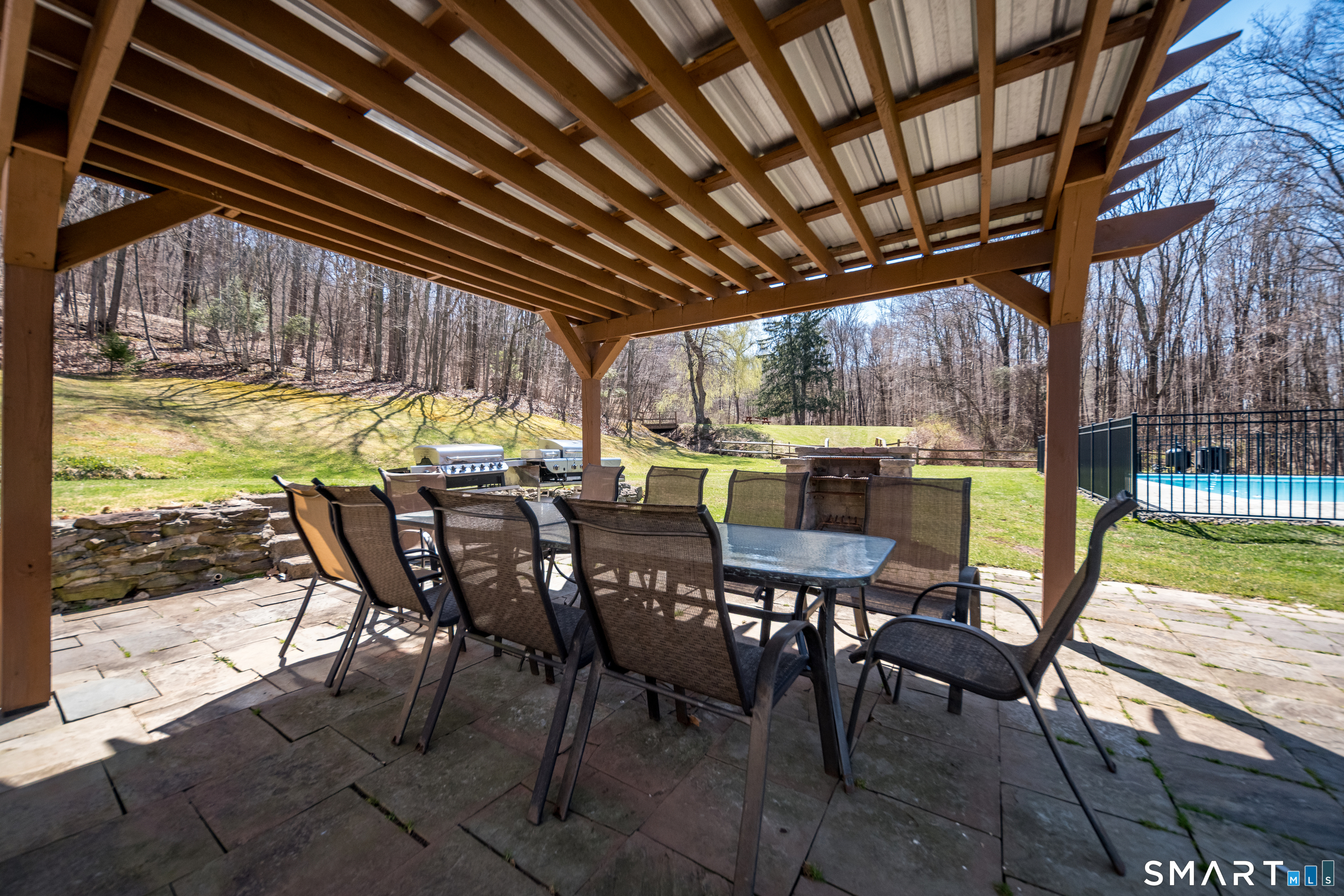 408 R Stage Coach Road Durham, CT 06422 - Photo 27 of 40 a view of a patio with table and chairs and wooden floor