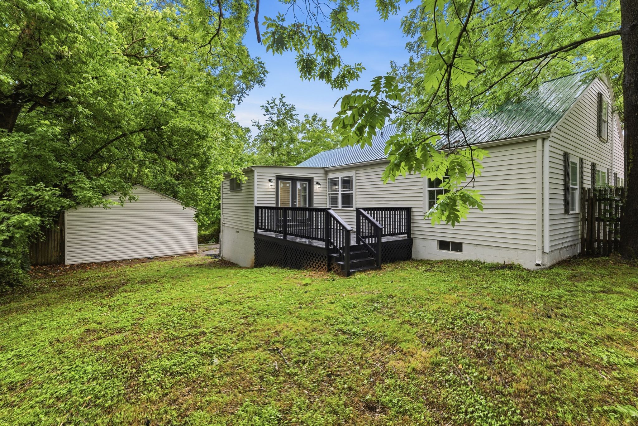 305 South Irwin Street Manchester, TN 37355 - Photo 39 of 40 a view of a house with a backyard