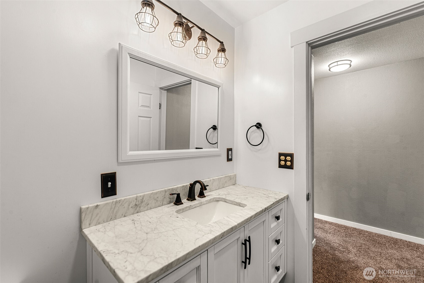 709 Schons Place Wenatchee, WA 98801 - Photo 14 of 28 a bathroom with a granite countertop sink and a mirror