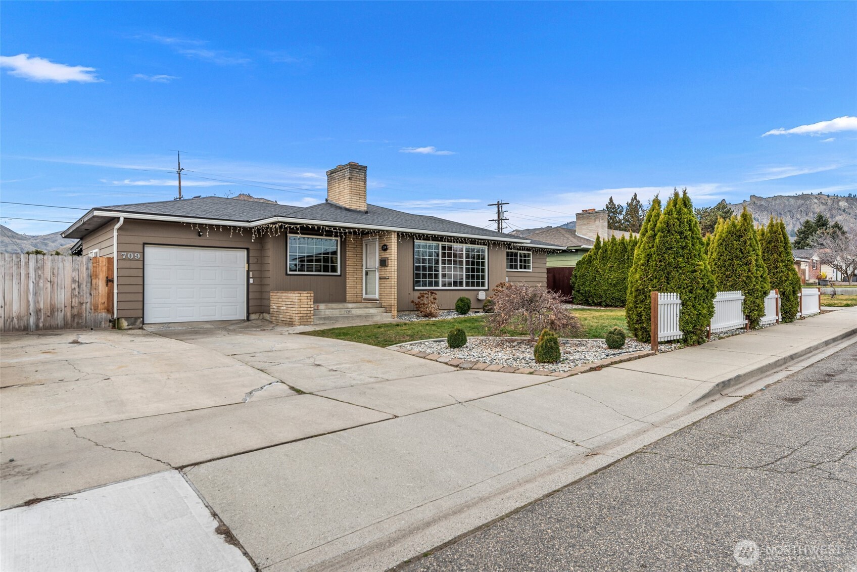 709 Schons Place Wenatchee, WA 98801 - Photo 2 of 28 a front view of a house with a yard