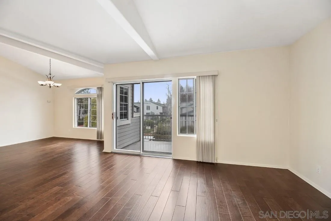 8637 Via Mallorca, Unit E La Jolla, CA 92037 - Photo 14 of 34 wooden floor in an empty room with a window