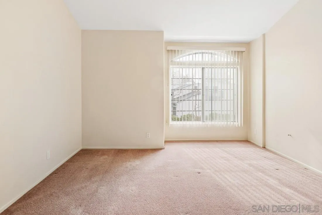8637 Via Mallorca, Unit E La Jolla, CA 92037 - Photo 19 of 34 an empty room with windows