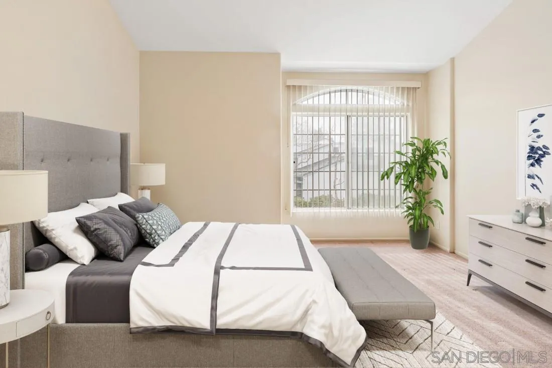 8637 Via Mallorca, Unit E La Jolla, CA 92037 - Photo 20 of 34 a bedroom with a bed and a window