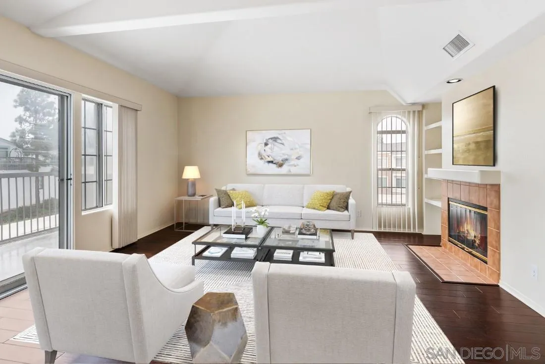 8637 Via Mallorca, Unit E La Jolla, CA 92037 - Photo 2 of 34 a living room with furniture and a fireplace