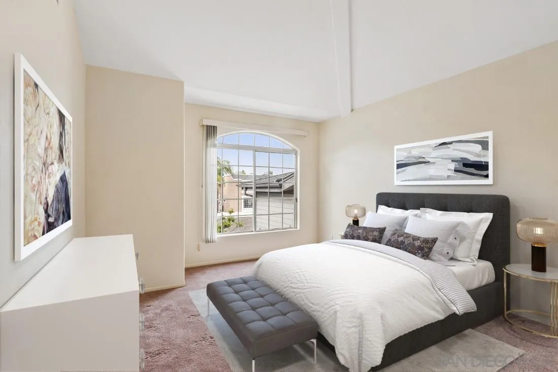 8637 Via Mallorca, Unit E La Jolla, CA 92037 - Photo 22 of 34 a bedroom with a bed and a window