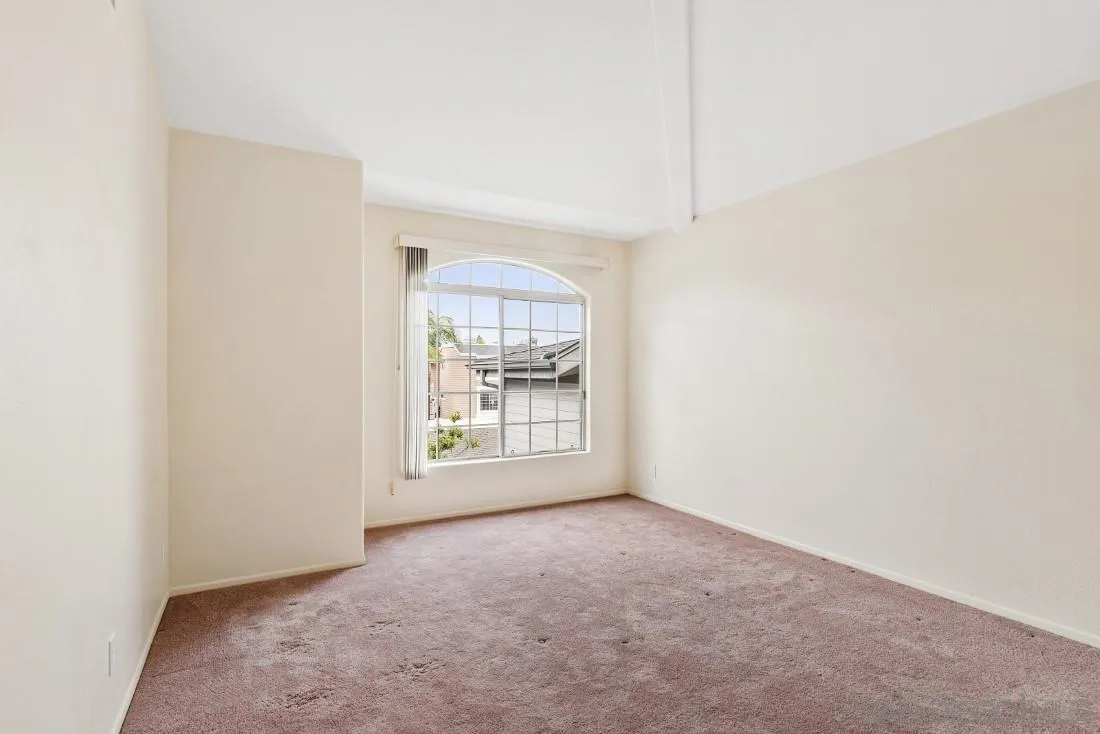 8637 Via Mallorca, Unit E La Jolla, CA 92037 - Photo 23 of 34 a view of an empty room with a window