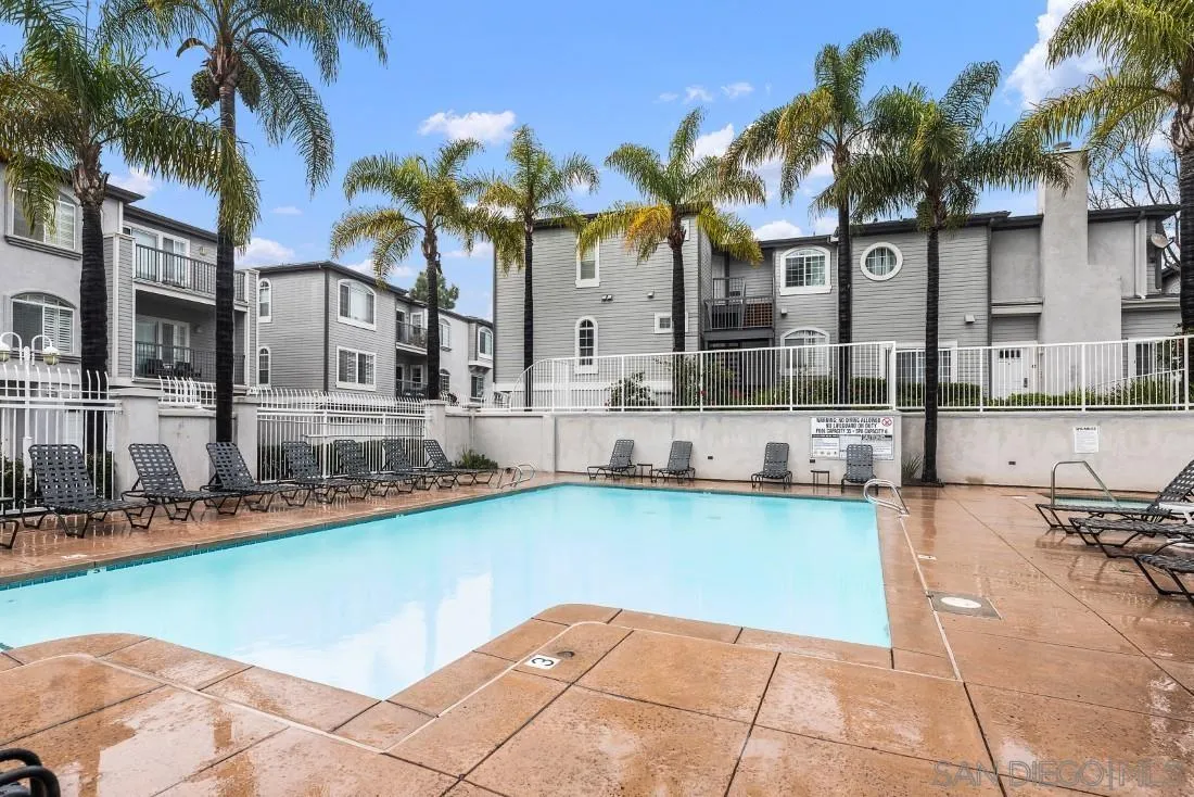 8637 Via Mallorca, Unit E La Jolla, CA 92037 - Photo 28 of 34 a view of a house with swimming pool and sitting area