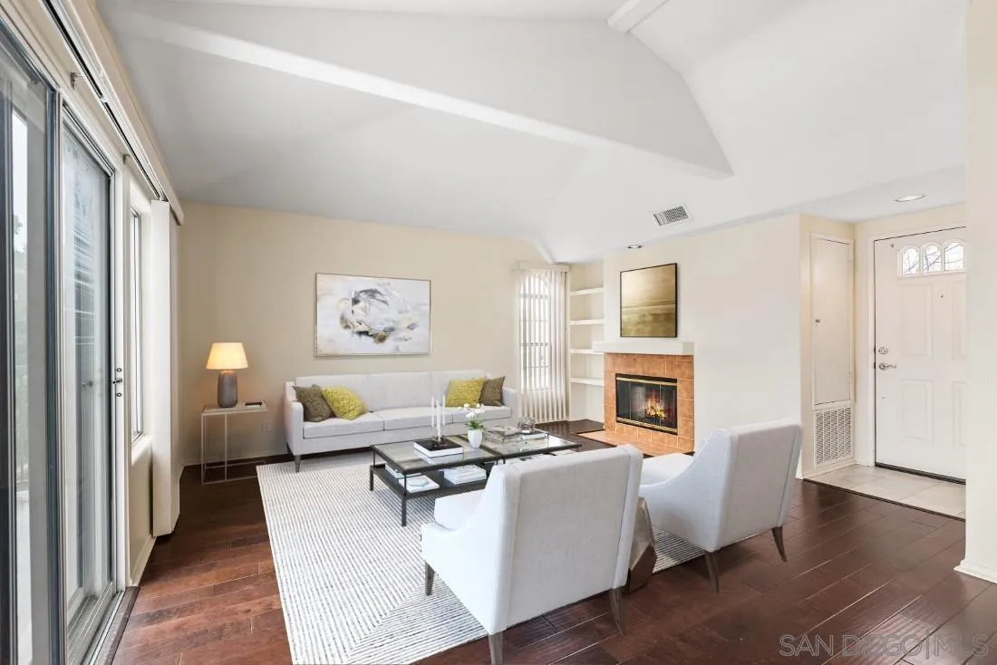 8637 Via Mallorca, Unit E La Jolla, CA 92037 - Photo 4 of 34 a living room with fireplace furniture and a wooden floor
