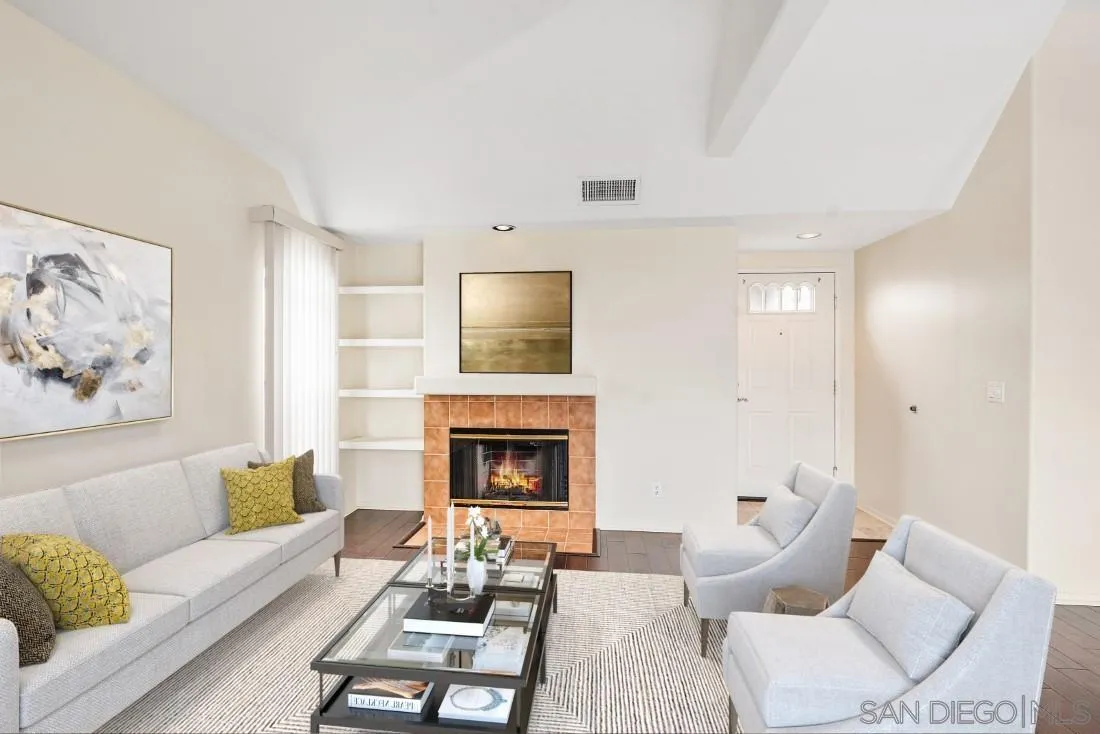 8637 Via Mallorca, Unit E La Jolla, CA 92037 - Photo 6 of 34 a living room with furniture and a fireplace