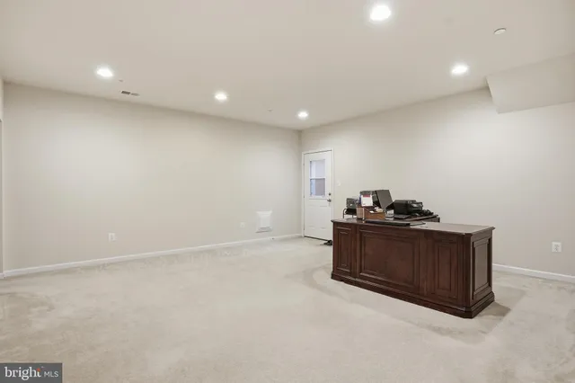 a room with furniture and kitchen