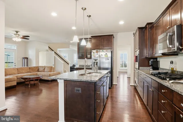 a kitchen with stainless steel appliances granite countertop lots of counter top space