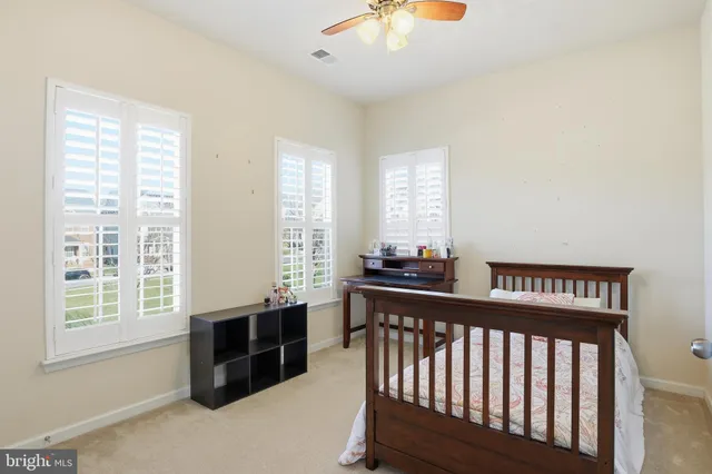 a view of a room with furniture and windows