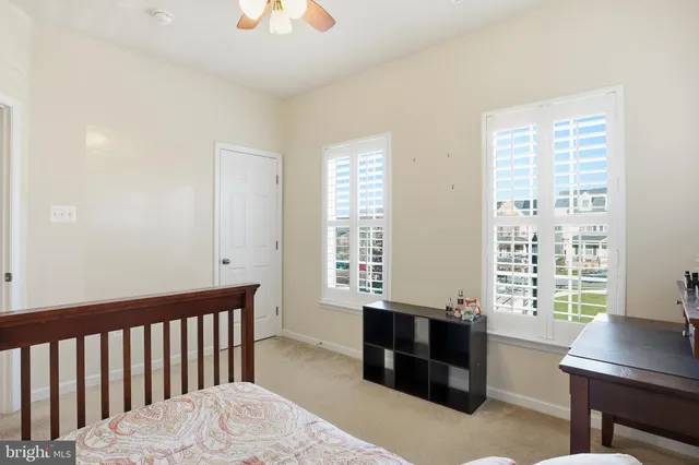 a bedroom with furniture and a window