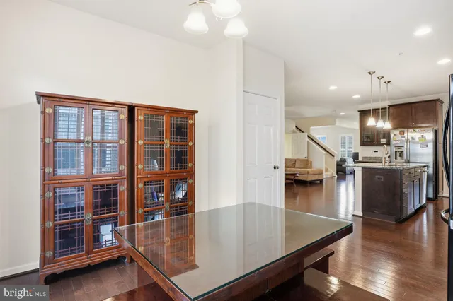 a view of kitchen and dining room with wooden floor