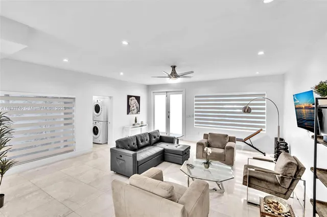 a kitchen with stainless steel appliances kitchen island granite countertop a table and chairs