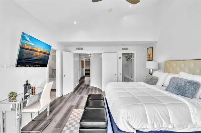 a spacious bathroom with a double vanity sink and a mirror