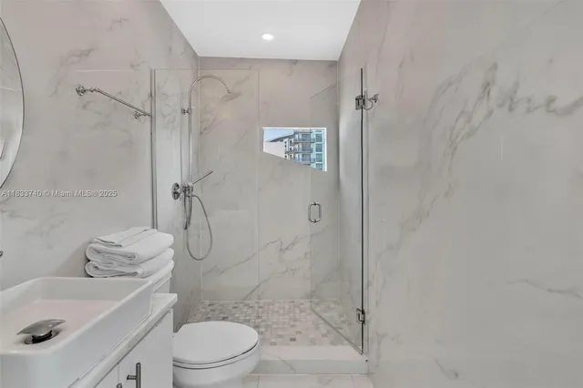 a bedroom with a bed and a tv